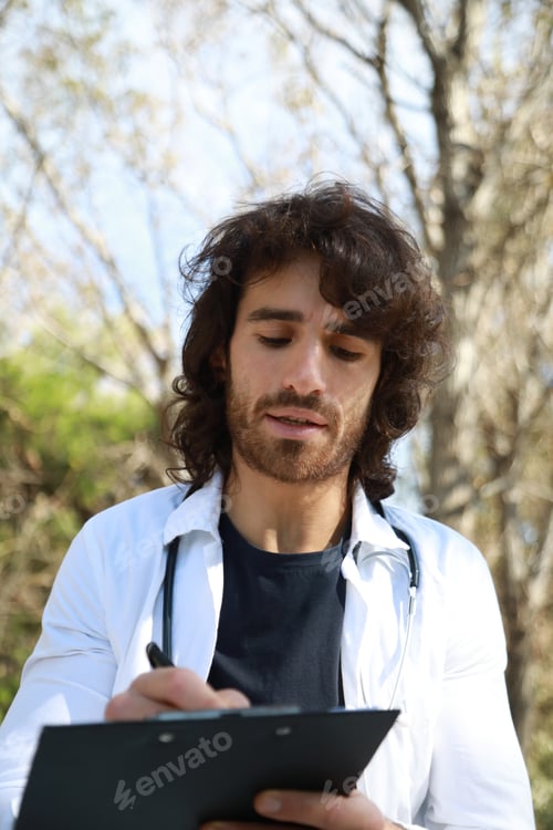 Preview: Young Man Trainee Doctor Repeat Lesson Sitting in Park Outside University Clinic