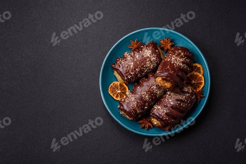 Preview: Delicious sweet chocolate cakes with fruit filling and sprinkles on a ceramic plate