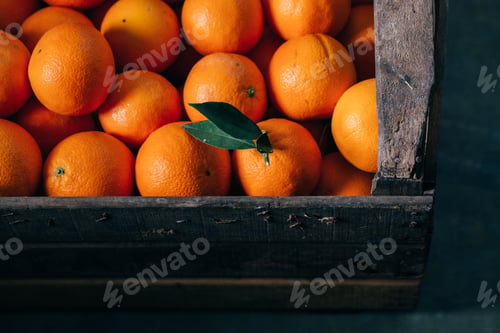 Preview: Fresh oranges in an old wooden box