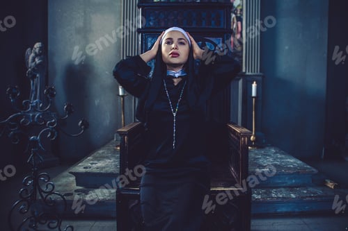 Preview: Nun praying in a monastery