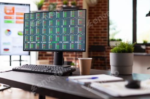 Preview: Empty desk with stock market exchange on monitor