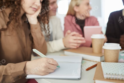 Preview: Young Woman Writing in Library Close Up