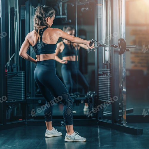 Preview: Woman Doing Exercise on a Machine in a Gym