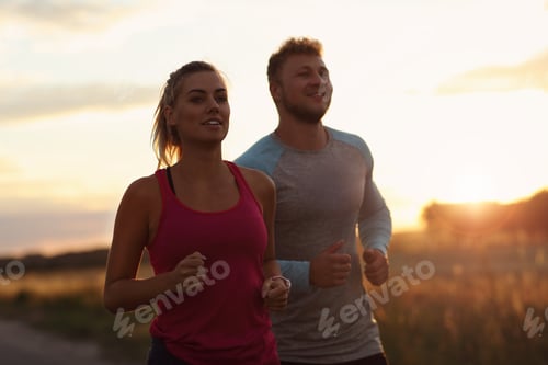 Preview: Young couple jogging in the suberbs after sunset