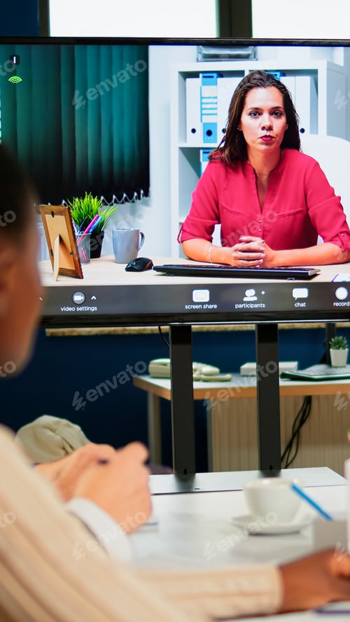 Preview: Woman ceo speaking at webcam during virtual business video presentation