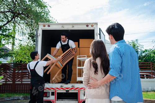 Preview: Asian Couple check while unloading boxes and furniture from a pickup truck