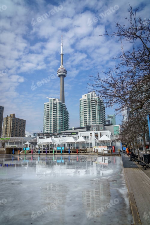 Preview: Vertical shot of a low angle view of the CN Tower in Toronto under the calm sky