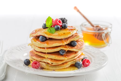 Preview: American pancakes for breakfast in the morning on white background