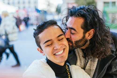 Preview: Man with long hair and beard kissing another man