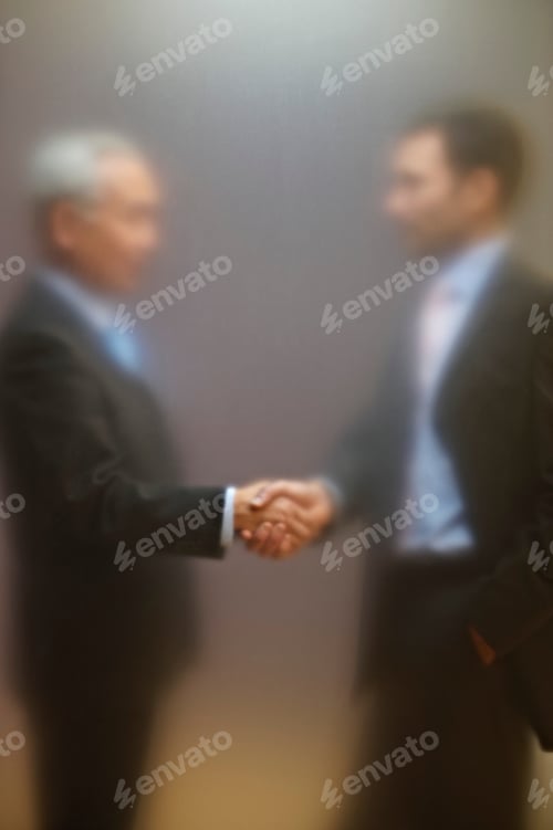 Preview: Men shaking hands behind frosted screen