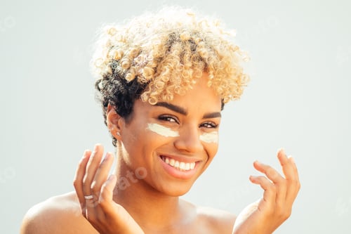 Preview: cute hispanic girl apply tone cream on perfect skin . anti acne concept