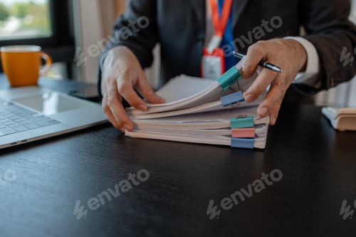 Preview: an accounting and financial officer is working on documents in the office