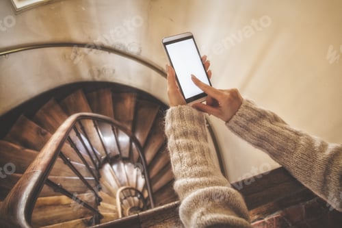 Preview: Girl Using Cellphone On The Stairs In The Building.