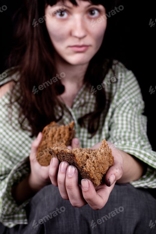 Preview: Poor beggar woman with a piece of bread.