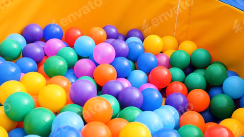 Preview: Colorful plastic balls in a pool for for children. Stock footage. Close up of lots of colored balls
