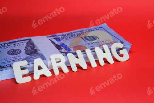 Preview: paper money with wooden word income. Business concept
