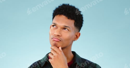 Preview: Thinking, confused and man doubt choice in studio isolated on a blue background mockup space. Solut
