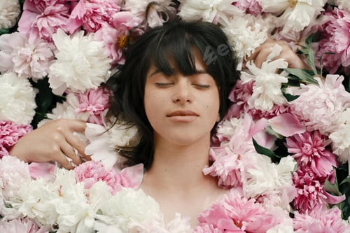 Preview: Happy boho woman portrait with peony flowers