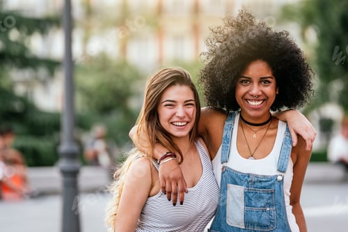 Preview: Beautiful women having fun in the street.