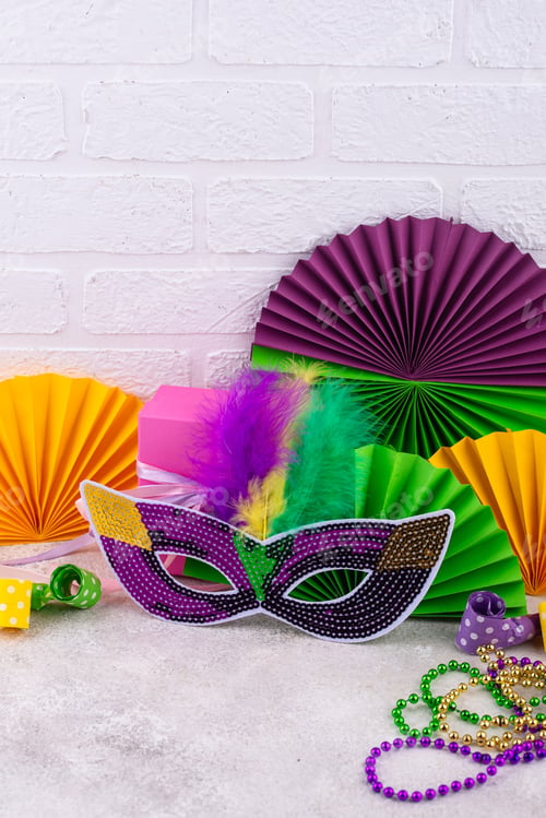 Preview: Vibrant Mardi Gras background with mask, beads, and festive decorations