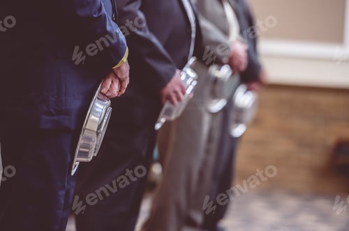 Preview: Closeup shot of elegant men with trays