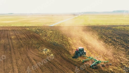 Preview: 4K Aerial Elevated View.Tractor Plowing Field. Beginning Of Agricultural Spring Season. Cultivator