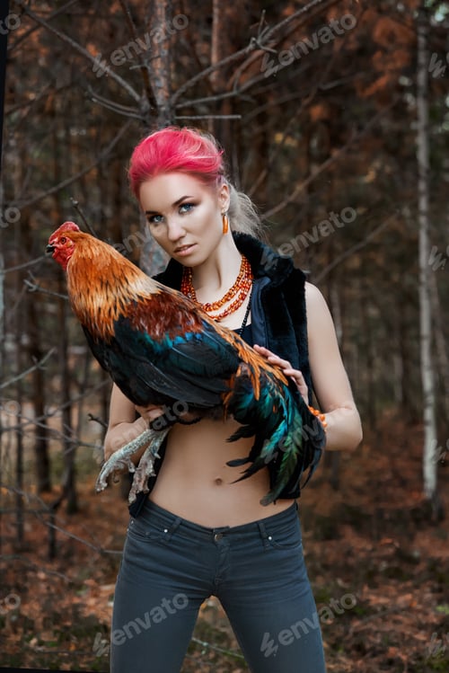 Preview: Woman holding a rooster in her hands, red makeup on girl face. Creative hot pink makeup