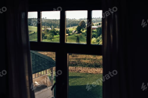 Preview: Beautiful view from cabin window on green mountain hills