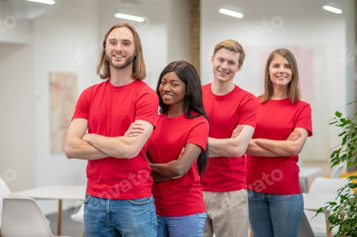 Preview: Enthusiastic Team Posing in an Office Setting