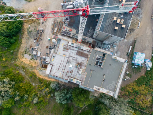 Preview: Aerial shot of a bustling construction site, featuring tower cranes and a variety of machinery
