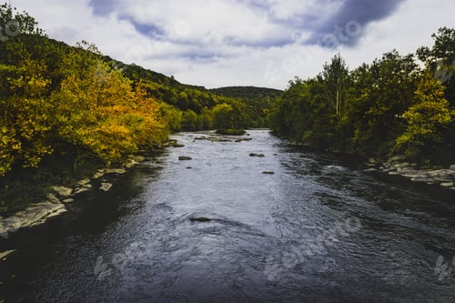 Preview: View of Youghiogheny River with beautiful trees and clouds near Ohio Pyle State Park in Pennsylvania