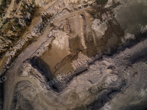 Preview: Aerial view of Slope operating granite quarry with mining equipment on ledges