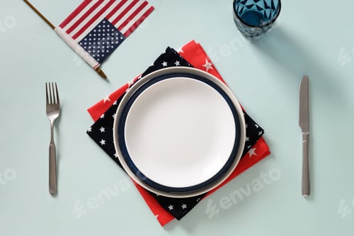 Preview: Table setting for Independence Day on white.