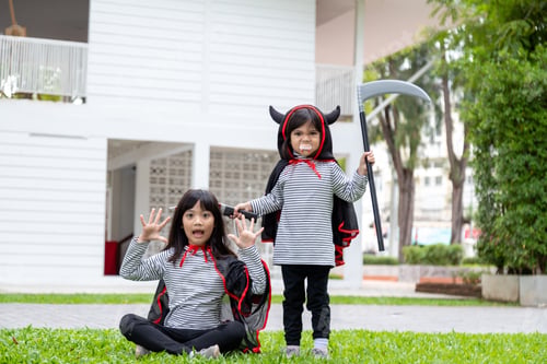 Preview: Two girls in the park with Halloween costumes, having fun