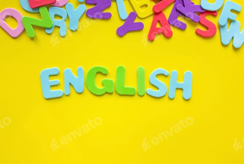 Preview: Colored English word on yellow background composed from colorful alphabet letters with copy space.