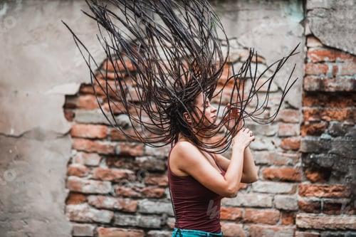 Preview: Woman With Long Afro Braided Hair Having Fun Outdoor