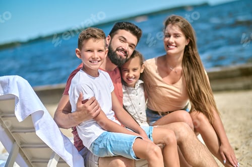 Preview: Happy Family Enjoying Summer Day on the Beach
