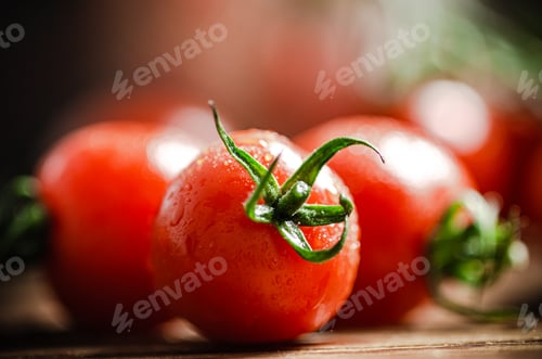 Preview: Fresh tomatoes. On wooden table.