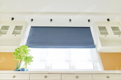 Preview: Interior of room, workplace near window, furniture, desk, blue roman blind, wall shelves