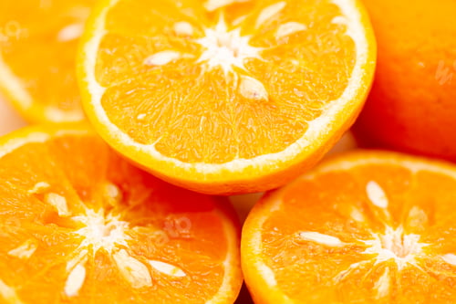 Preview: Oranges on pink background. One orange is cut in half, the other is whole.