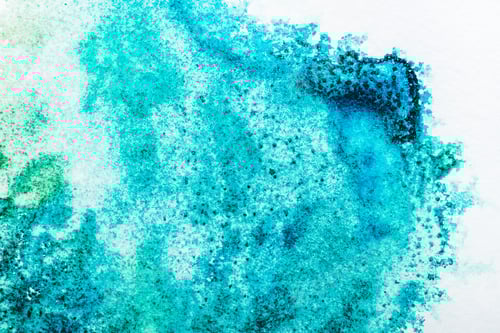 Preview: top view of turquoise watercolor spill on white background