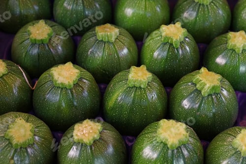 Preview: Close up fresh green zucchini on retail display