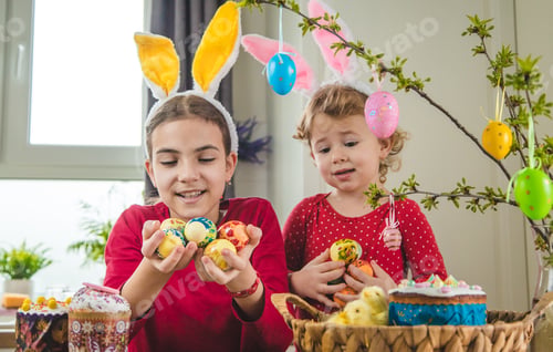 Preview: Happy Easter kid with eggs. Selective focus.