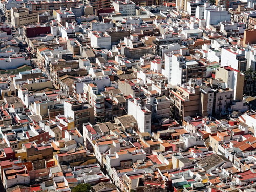 Preview: densely packed urban area with various buildings and rooftops in the town of Cullera, Spain