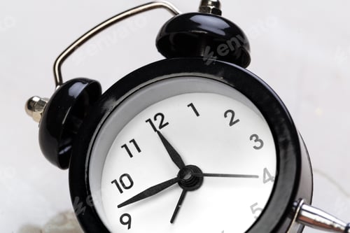 Preview: black vintage alarm clock on color background