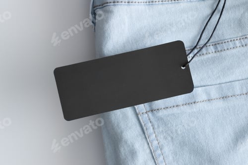 Preview: Black clothing tag mockup on a jeans.