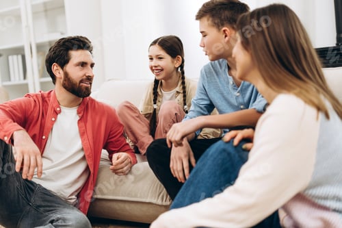 Preview: Happy family talking and bonding at home