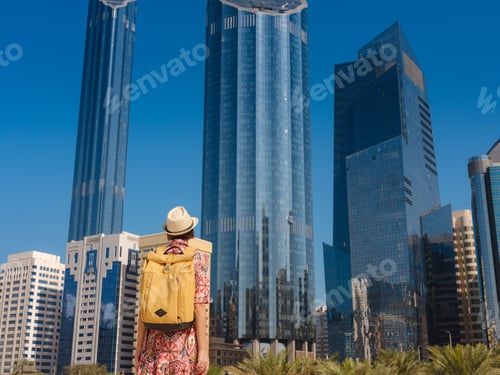Preview: Young female tourist exploring iconic landmarks of the United Arab Emirates.