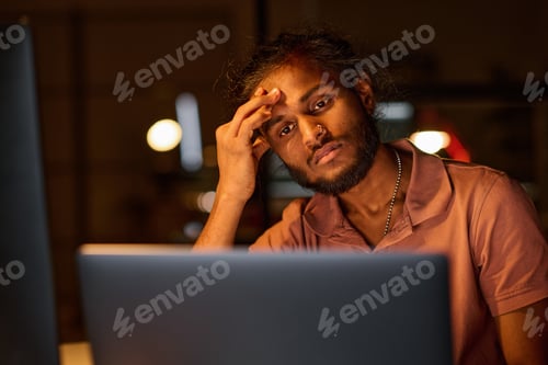 Preview: Tired programmer working over new program