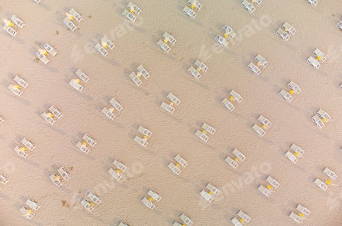 Preview: Aerial view of empty sandy beach with beach umbrellas and chairs at summer day. Black sea, Bulgaria